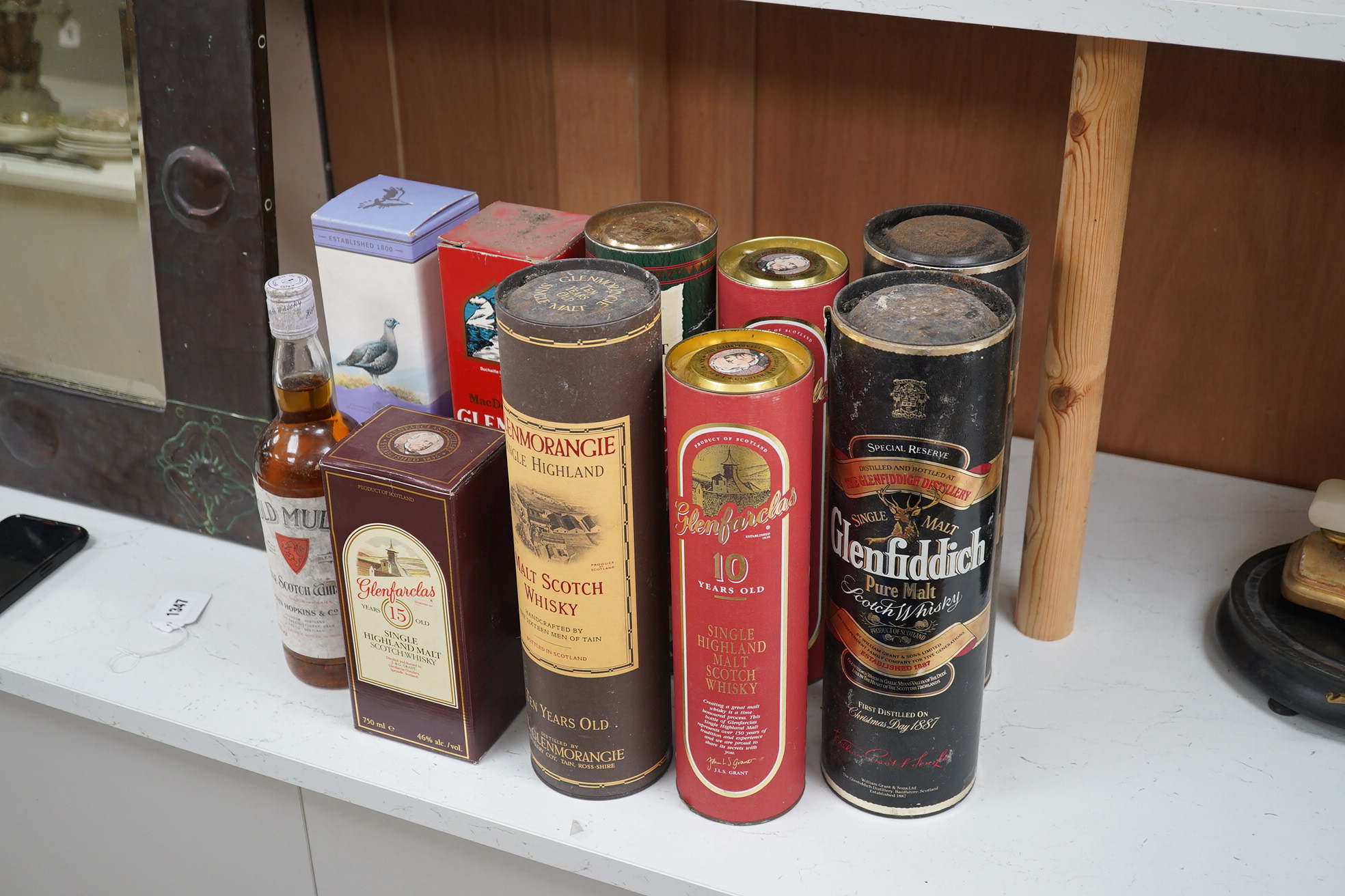 A group of ten bottles of Scotch Whisky; Glenfiddich Pure Malt Special Reserve 1 litre x2, Glenmorangie ten year 1litre, Glenlivet 12 year 70cl, Macdonalds Glencoe 8 year 70cl, The Famouse Grouse 10 year 70cl, John Hopki